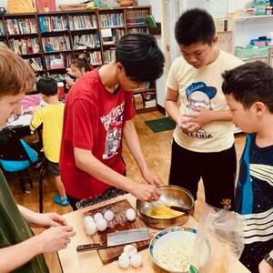 Summer camp preparing meal for elderly group