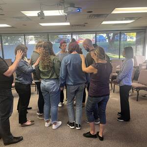 Praying over new workers