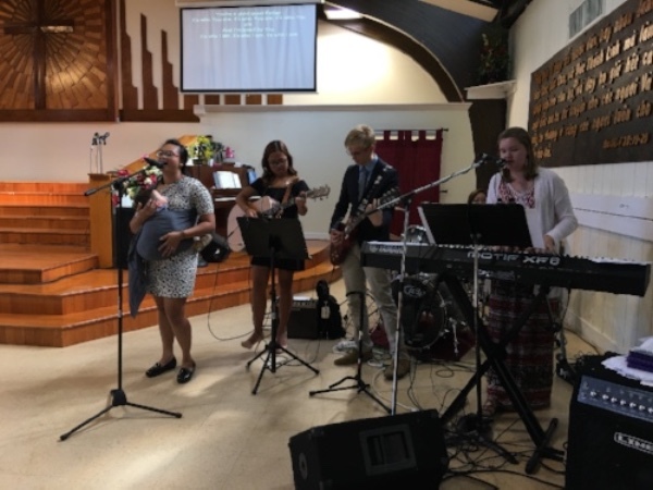 Us playing worship at the Vietnamese Church--working to train up more youth to join the band (one so far!).